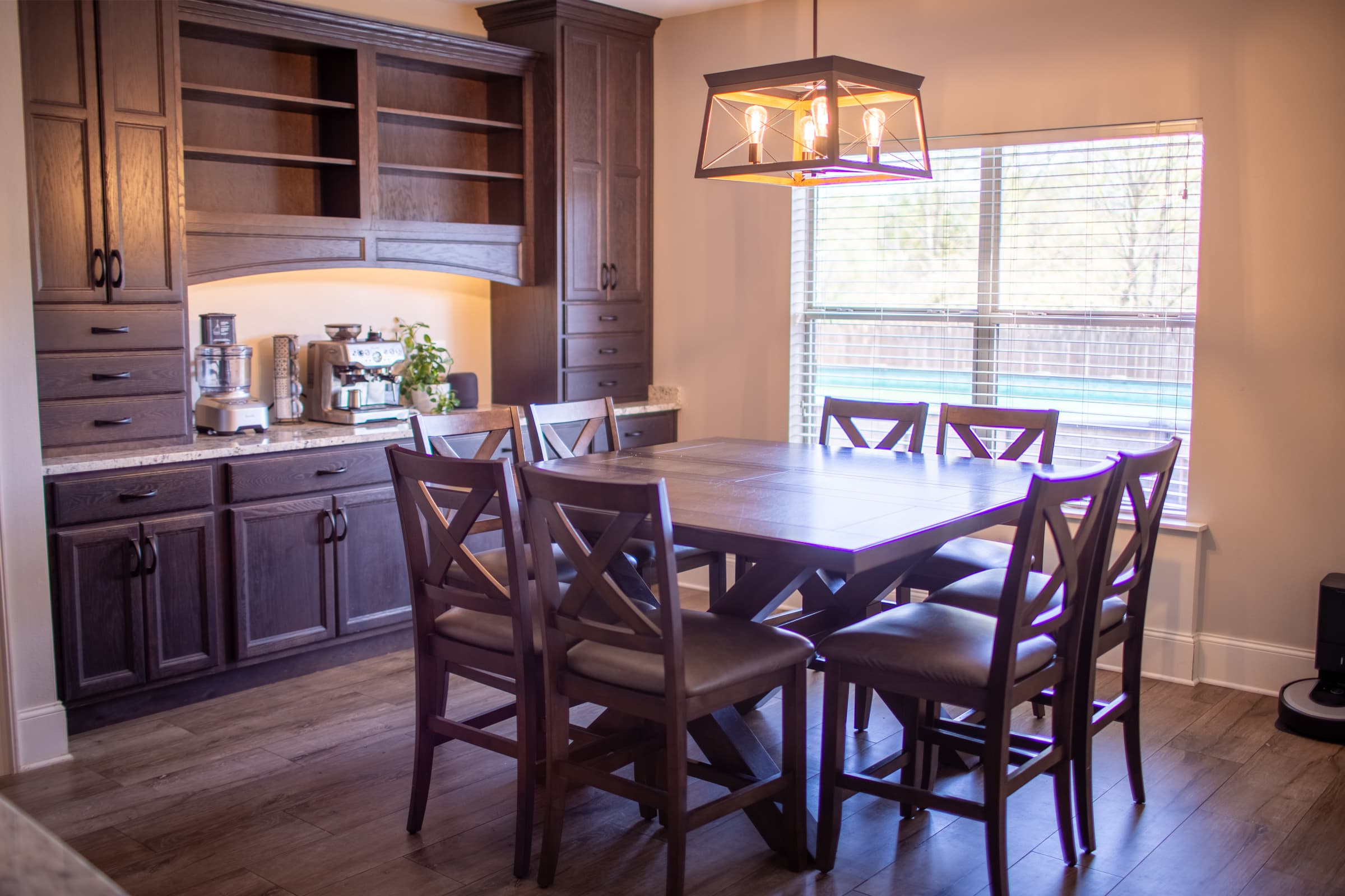 Dining room with built-in cabinetry and chandelier