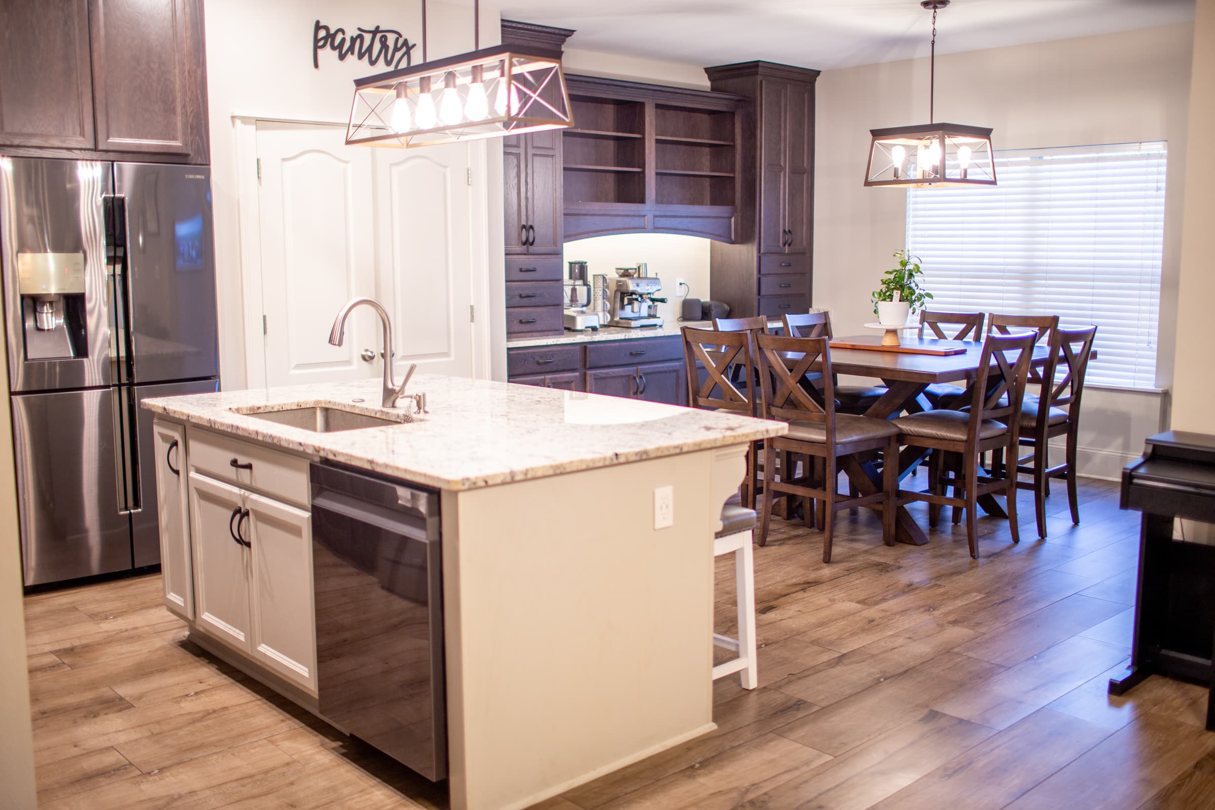 Kitchen island and dining area with pendant lighting
