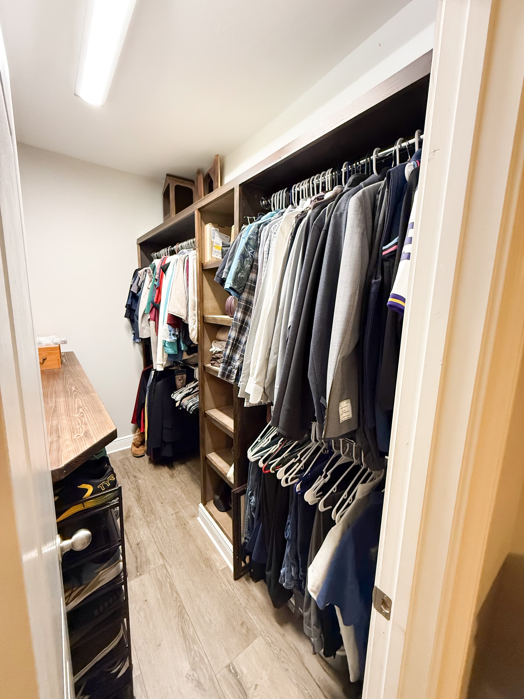 Walk-in closet with custom shelving and organization