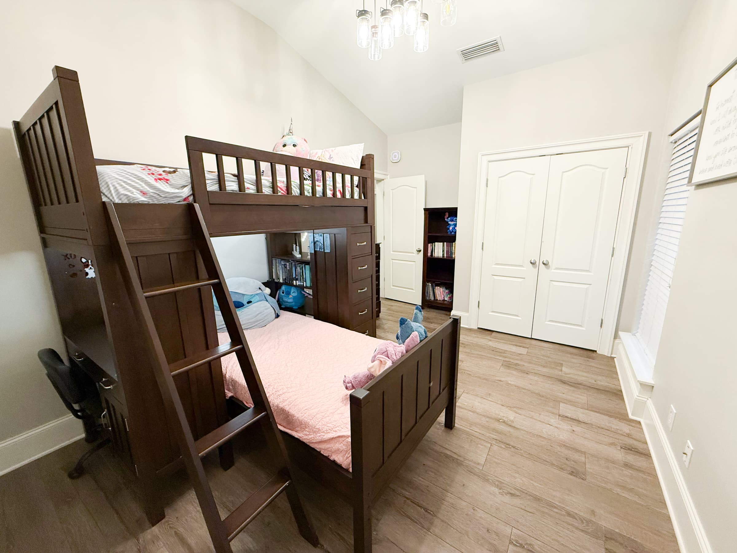 Bedroom with bunk bed and double closet doors