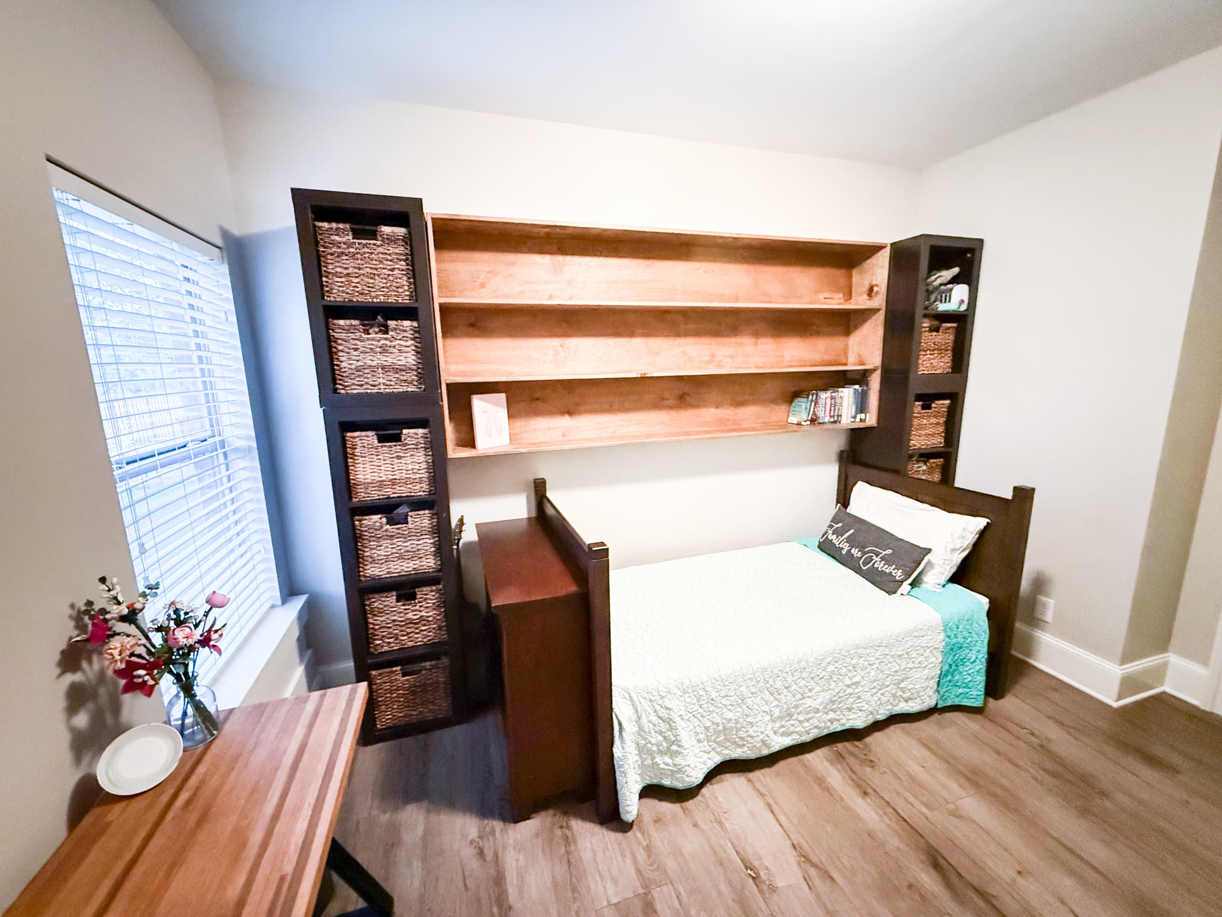 Bedroom with custom built-in shelving and storage