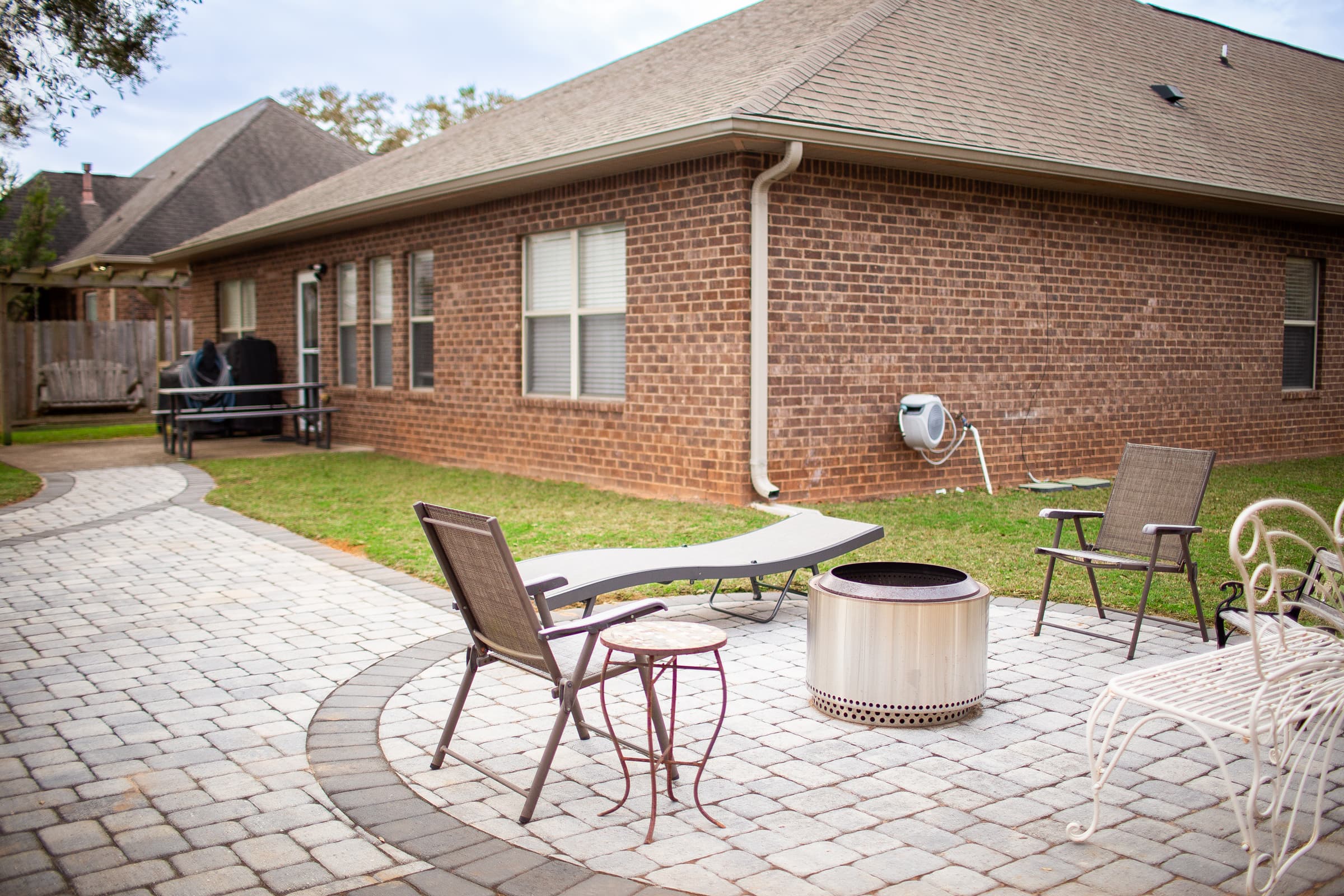 Back exterior with patio and fire pit